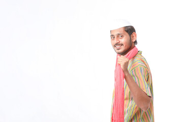 Young indian farmer in traditional wear and giving expression on white background.