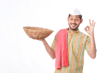 Indian man holding wooden bowl in hand on white background.