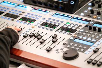 Sound engineer using mixing console
