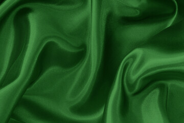 Obraz premium Dark green fabric cloth texture for background and design art work, beautiful crumpled pattern of silk or linen.