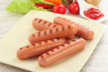 Grilled sausages with tomato sauce