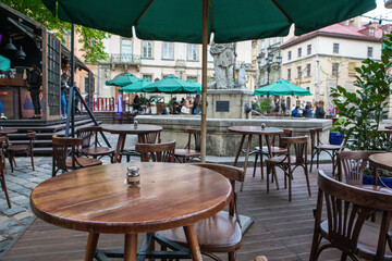 outdoors street cafe with empty tables