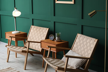 Interior of modern living room with chairs, wooden tables and lamp