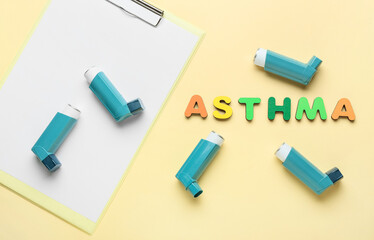 Clipboard, inhalers and word ASTHMA on color background