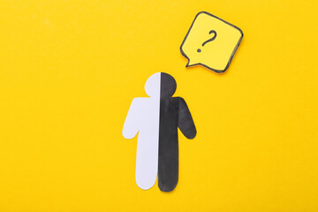 Paper human figure with question mark on yellow background