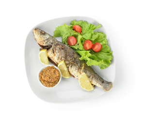 Plate with delicious sea bass fish, vegetables and bowl with mustard seeds on white background