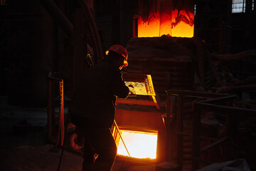 Metallurgist steelmaker takes a sample of liquid metal from a ladle. Steel ladle degassing unit VD  VOD. Steel production. Metallurgy. Industry