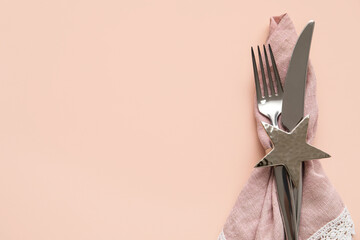 Stylish cutlery on pink background