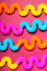 Different Pop Tubes on color background