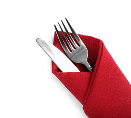 Fork and knife wrapped in red napkin on white background, top view - Powered by Adobe