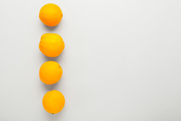 Ripe fresh oranges on white background