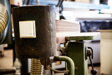 closeup of an belt grinder in a carpentry or workshop