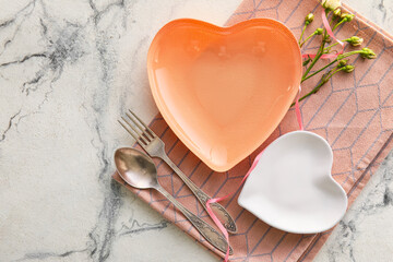 Stylish table setting for Valentine's Day on light background