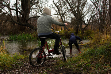 Boy sitting on bicycle	