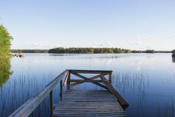 Naklejka premium wooden bridge over lake