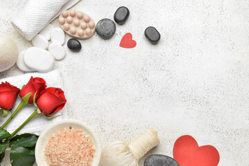 Beautiful spa composition with stones for Valentine's Day celebration on light background