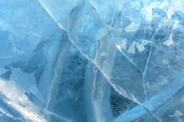 The pattern of cracked ice on the surface of the river. Ice texture as a natural background.