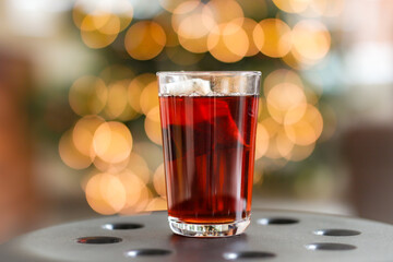 Shallow Depth of Field of Black Tea in Transparent Glass. Hot Beverage in Cup with Bokeh Background.