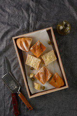 traditional baguette toasts baked with cheese, olives and olive oil.