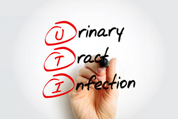 UTI - Urinary Tract Infection acronym with marker, health concept background - obrazy, fototapety, plakaty