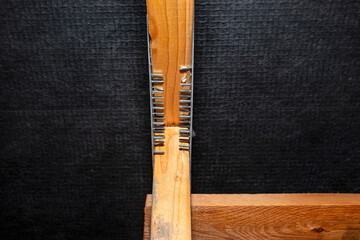 Barbed tile connecting the roof structure covered with a membrane on a single-family house, view from the inside.