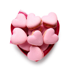 Box with tasty heart-shaped macaroons on white background