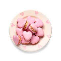 Plate with tasty heart-shaped macaroons on white background