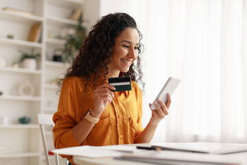 Woman Using Smartphone Shopping Online Holding Credit Card At Home
