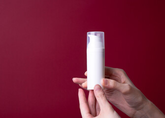 packaging of lotion or hand cream in female hands