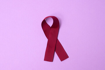 red ribbon symbol of the fight against AIDS