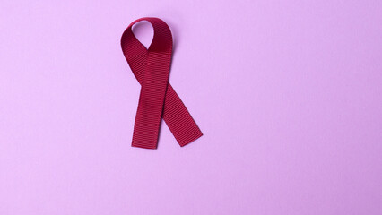 red ribbon symbol of the fight against AIDS