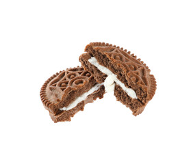 Broken tasty chocolate sandwich cookie with cream on white background