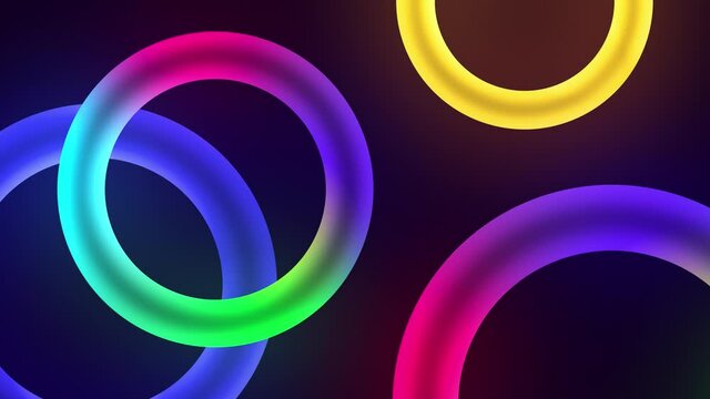 Colorful floating circles or torus neon lights in pink green and blue color. 4K 3D seamless loop animation abstract composition light glowing neon LED circle background.