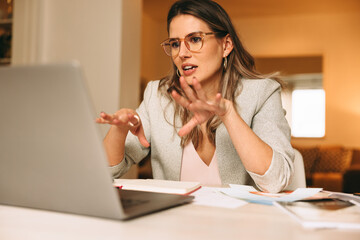 Smart interior designer explaining her plans during an online meeting