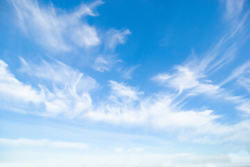 Blue sky with white soft clouds. Summer background. Clearing day and good weather in the morning.