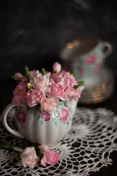 Still-life. Photo of pink flowers in a teapot.