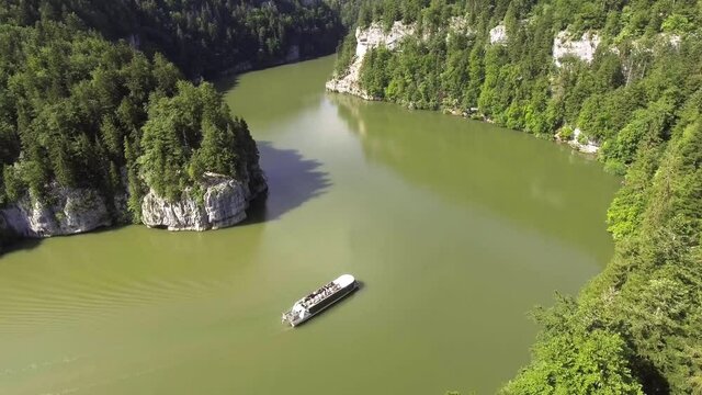 Tourist boat on the natural river Doubs in Switzerland, Lac de Brenets and Saut du Doubs