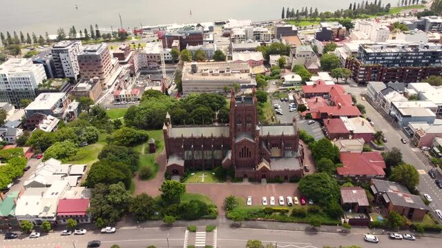 Aerial drone scenic city CBD shot with Church Newcastle Harbour tourism NSW architecture cityscape Hamilton Australia 4K