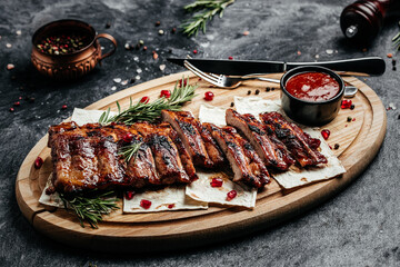 Grilled ribs on cutting board. Restaurant menu, dieting, cookbook recipe top view