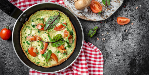 Frittata with fresh vegetables and cheese. Italian omelet in the pan. Keto, ketogenic lunch. banner, menu, recipe place for text, top view