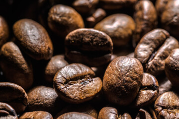 Freshly roasted coffee beans background. Coffee beans macro, texture.