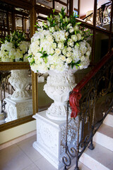 The composition is made by florists from fresh flowers at the party, wedding or celebration.