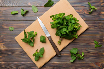 Fresh mint on Cutting board table, top view. Flat lay Space for text