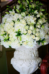 The composition is made by florists from fresh flowers at the party, wedding or celebration.