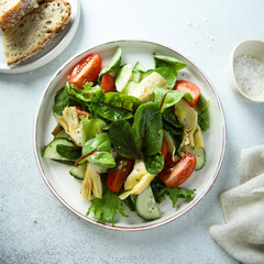 Artichoke salad with tomatoes and cucumber