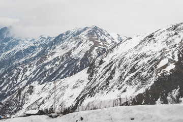 Fototapeta na wymiar Beautiful Caucasian panoramic view snowy slopes, European beautiful winter mountains in Georgia, cross country ski slopes in the landscape