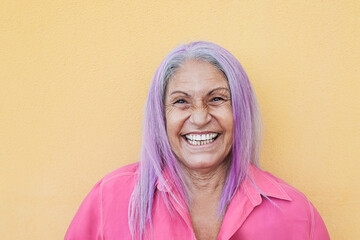 Senior woman smiling in front of the camera - Focus on face