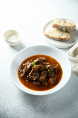 Traditional homemade beef goulash served with bread