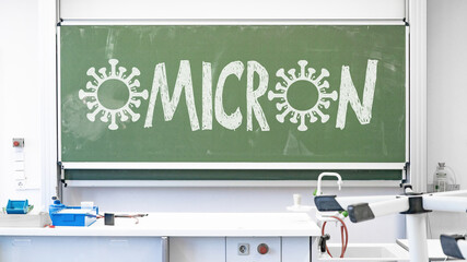 CORONAVIRUS - OMICRON background - Empty biology physics room in school with high chairs and virus...