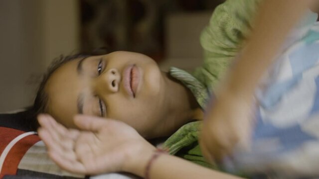Girl kid not able to sleep during night - concept of insomnia, sleeping disorder and loneliness